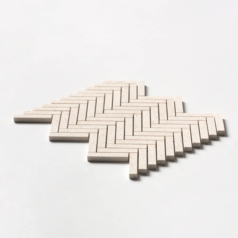 Desert Path limestone in a fine herringbone of slender sand-coloured batons, the sheet angled low against white.
