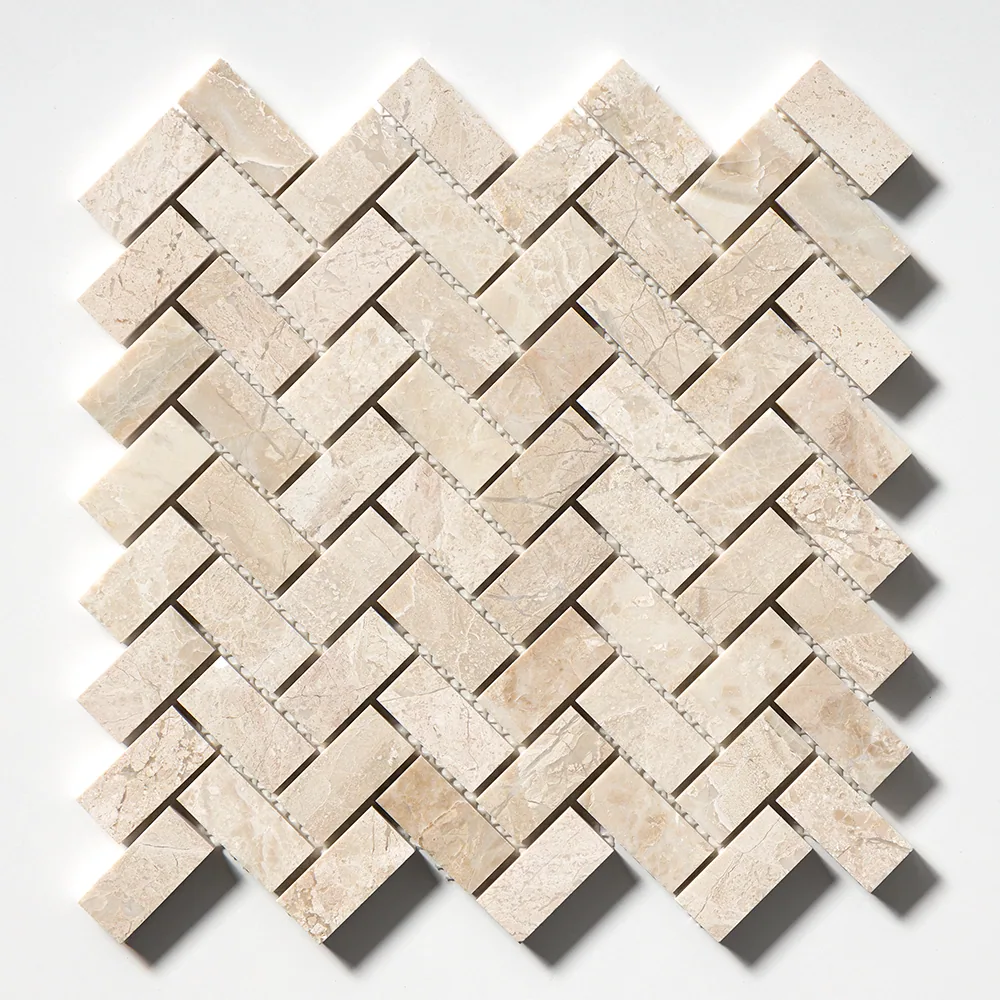 The same honed Diana Royal herringbone sheet seen straight on, showing the full weave and the pale grey veining that runs through the cream stone.