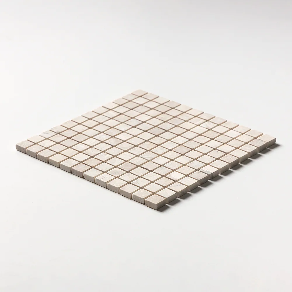 Tumbled Diana Royal mosaic of one-inch cream squares with softened edges, the sheet seen at a shallow angle.