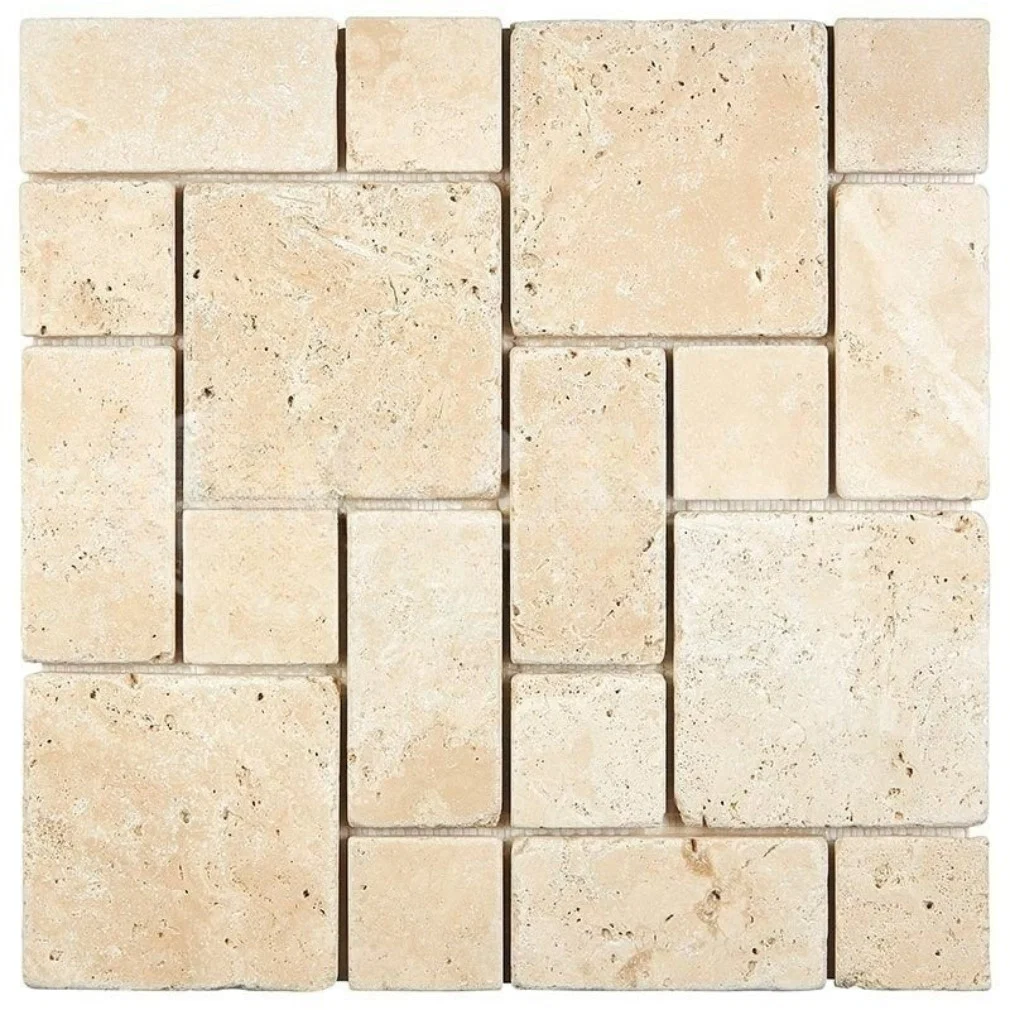 Tumbled Ivory travertine set in a repeating pattern of large squares with smaller rectangles between them, in warm cream with open pitting.