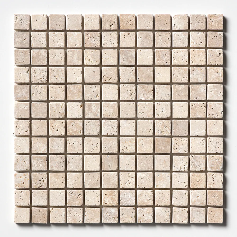 The one-inch Ivory travertine grid straight on, each small square carrying the open pitting typical of unfilled travertine.