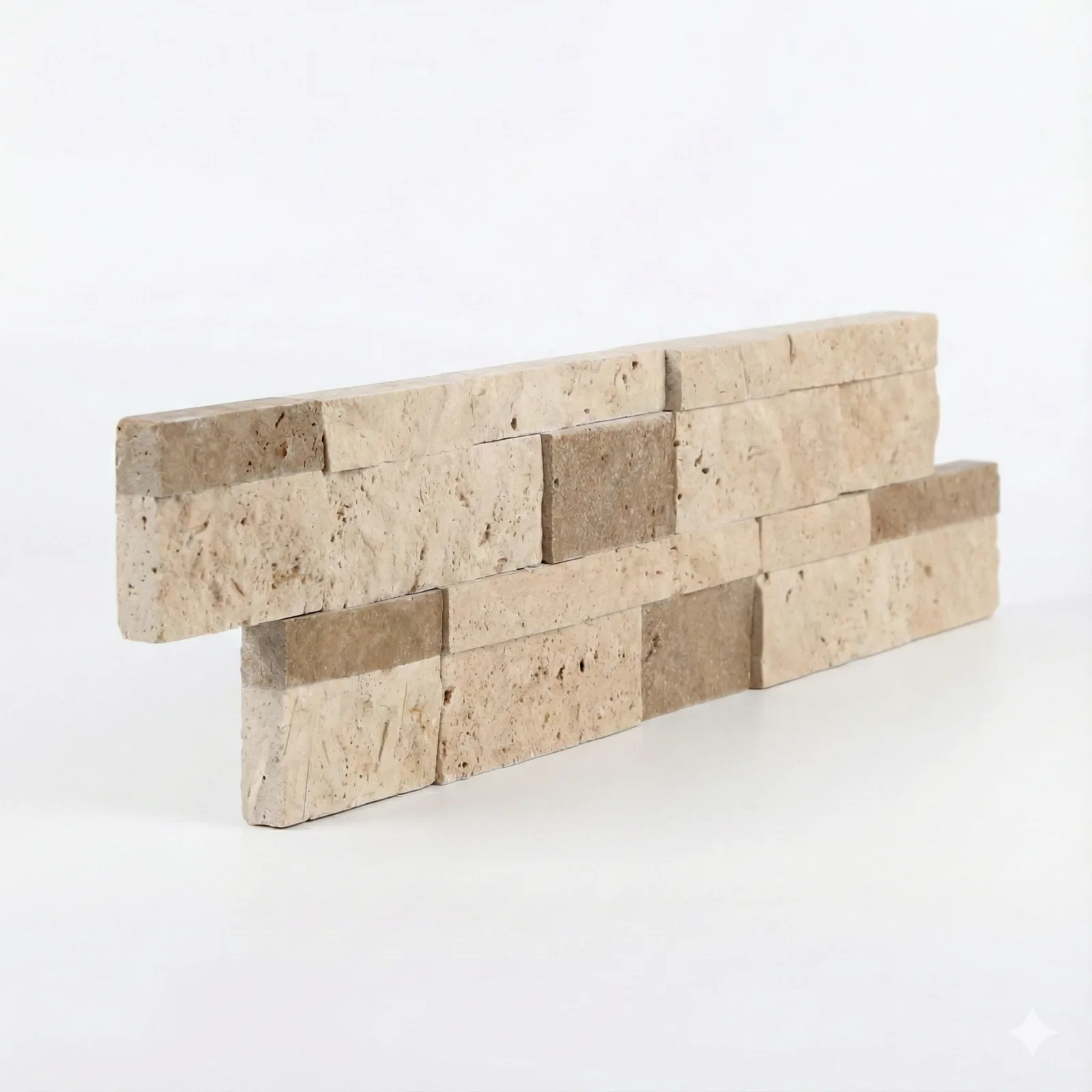 Light Noce travertine ledger panel corner piece on a pale studio ground: two offset courses of split-face travertine in warm sand and biscuit, stepping forward at their broken faces.