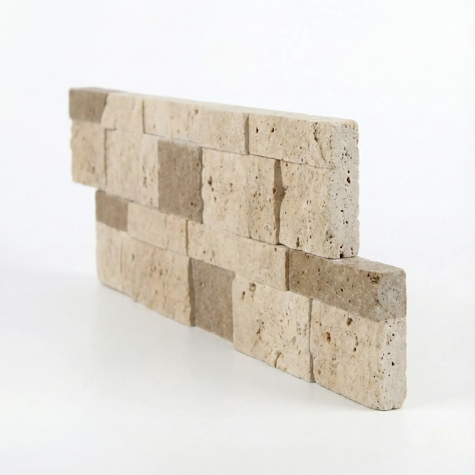 The same Light Noce corner piece seen closer to square on, showing the depth of the split faces and the brown and cream banding through the strips.
