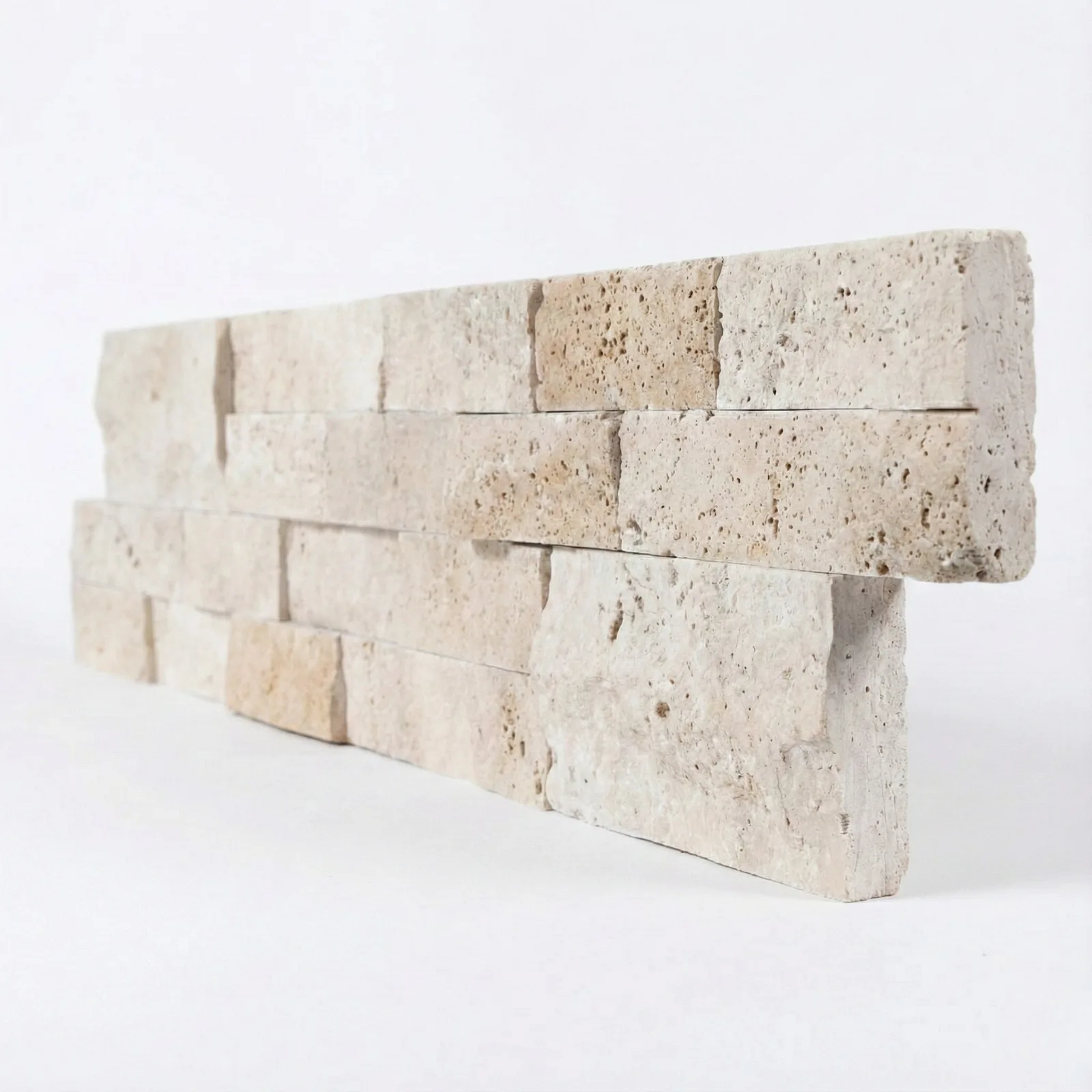 Light Travertine ledger panel corner piece on a pale studio ground, the deepest of the set, in chalk cream with faint grey and buff veining.
