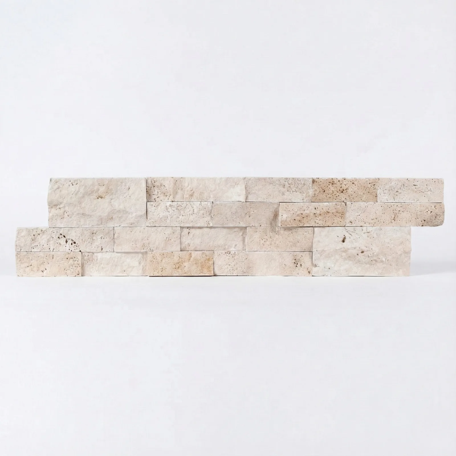 Light Travertine panel viewed almost frontally, the two offset courses reading as a flat band of pale cream strips.