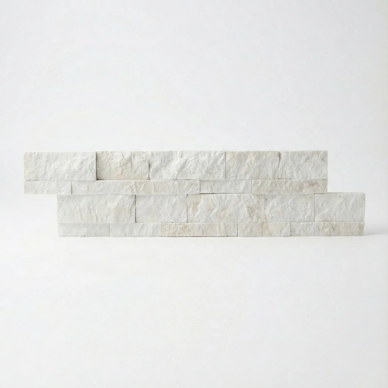 A Myra Beige marble ledger panel photographed straight on, the split face showing its warm cream banding.