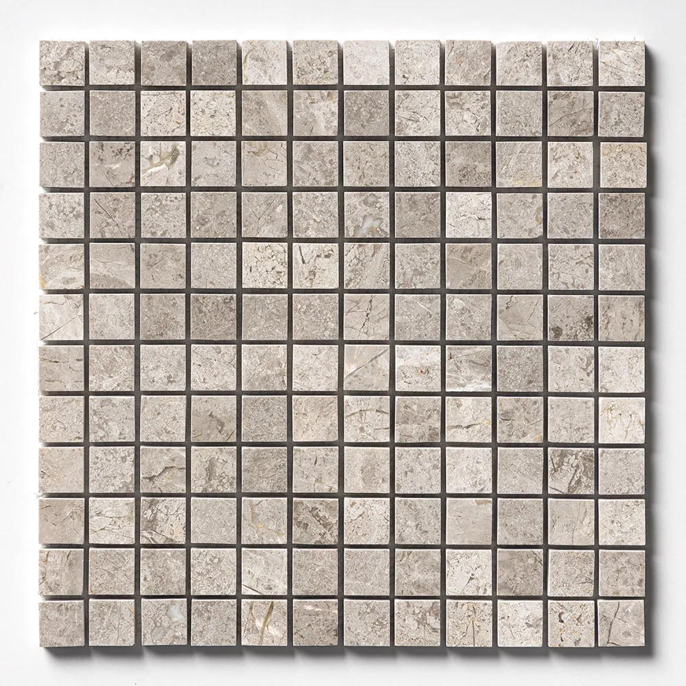 The full one-inch Silver Clouds grid straight on, warm grey squares with paler cloudy drifts running through the stone.