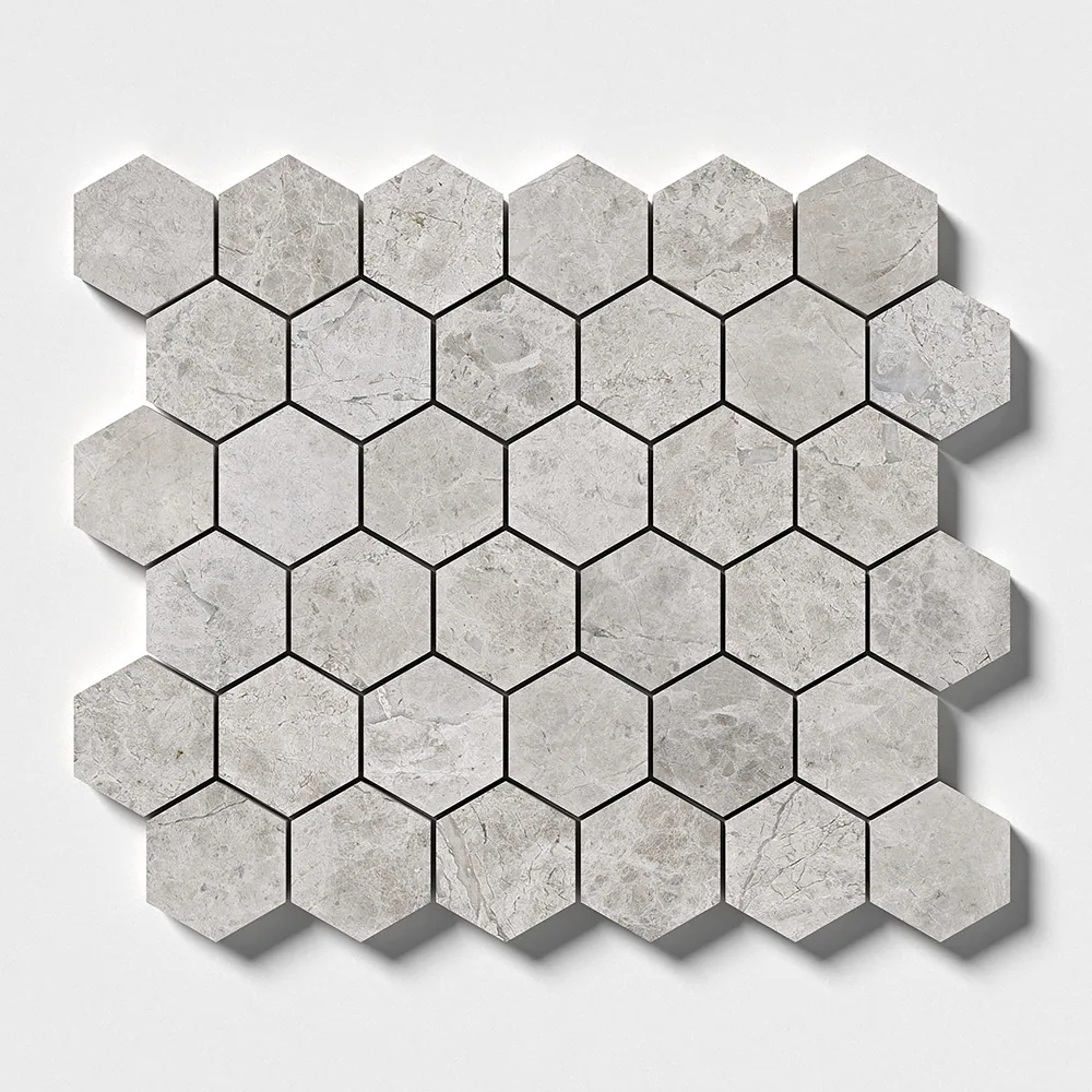 Two-inch hexagons of polished Silver Clouds marble seen straight on, pale grey with soft cloudy mottling and darker grout lines.