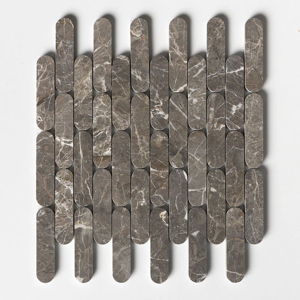 The Pill sheet straight on, columns of rounded-end brown-grey chips with white veining running through them.
