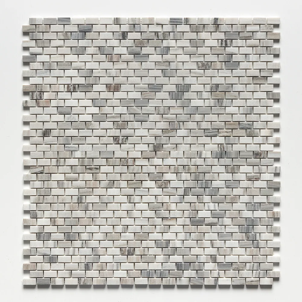 Verona marble mosaic of small brick-shaped chips in offset rows, the sheet straight on, drifting from white through grey to warm tan.