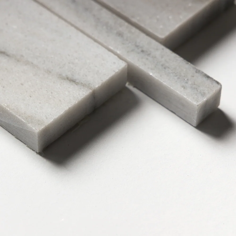 Close detail of two polished Verona strips, showing the sawn edge and the half-inch thickness of the stone.