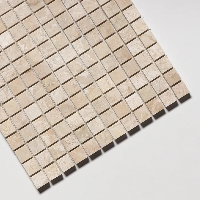 Polished Diana Royal mosaic of one-inch cream squares, angled steeply so the mesh backing shows along the far edge.