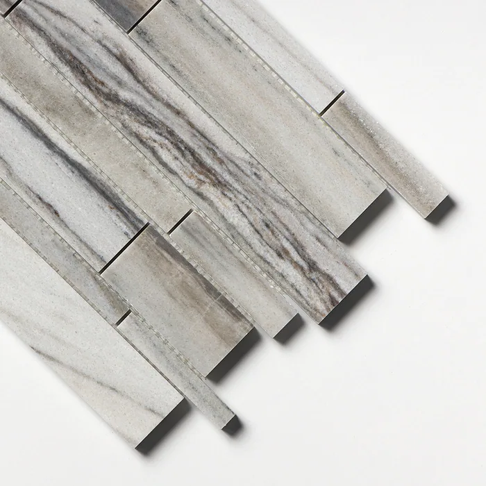 Polished Verona marble mosaic of long narrow strips, angled to catch the light across grey and white stone with strong brown veining.