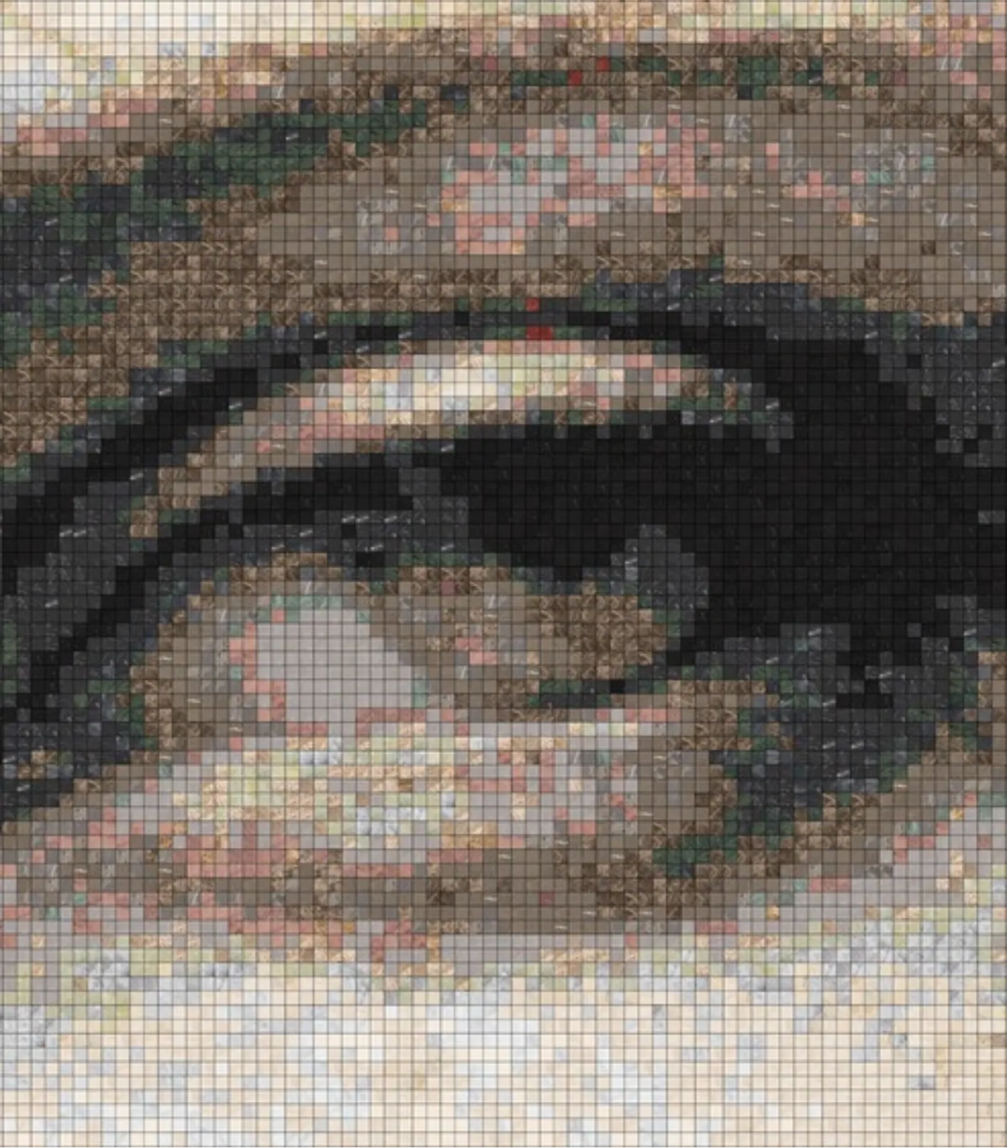 Close view of the simulation: a single eye and brow resolved into individual square stones.