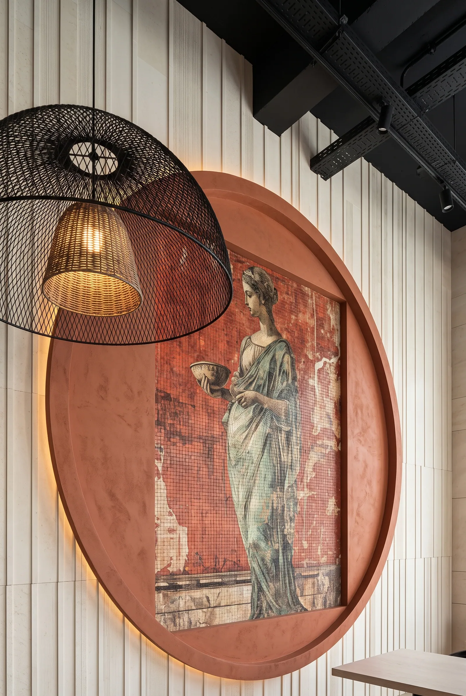 A simulation of the same figure set within a round wall opening behind a woven pendant shade.